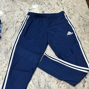 Barely used Adidas Jogger, blue with zippered pockets and legs, size Mens Medium